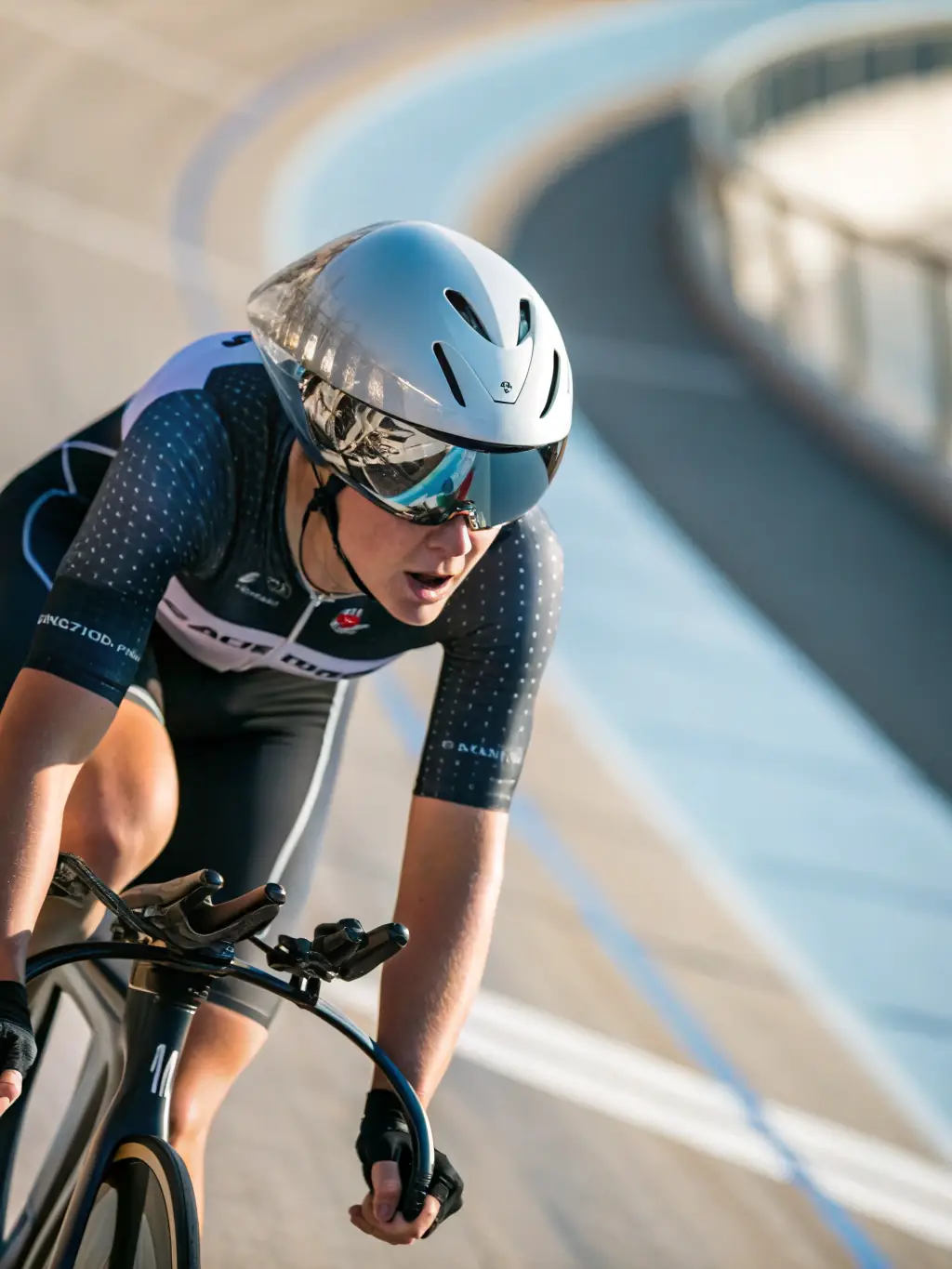 A cyclist wearing LE VELO MONTAGNARD branded gear, participating in a competitive cycling race, demonstrating the organization's support for competitive cycling.