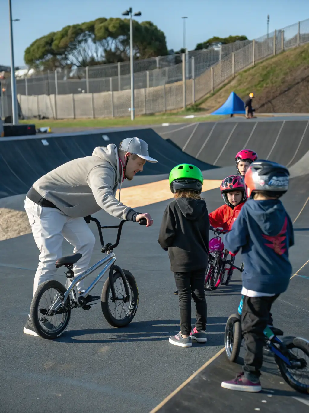 A photo captures a training session led by LE VELO MONTAGNARD instructors, teaching cycling safety and maintenance skills to community members, empowering them with valuable knowledge.